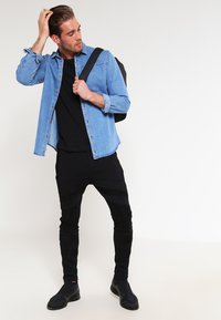 Urban Classics T-shirt print - dark camo