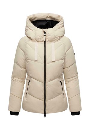 Kerge beež puffjakki, millel on kõrge krae, vertikaalne lukukinnitus ja kaks küljetaskut. Omab kontrastset musta varrukat ja v-kujulist õmblust.