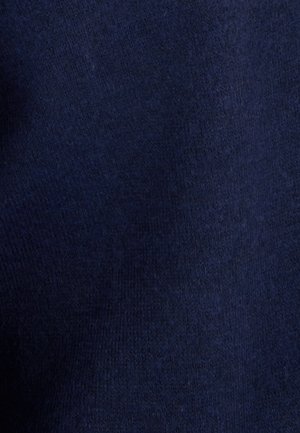 Marineblauwe stof met een gladde textuur, met een fijn breipatroon. Effen kleur met minimale variatie in het oppervlak.