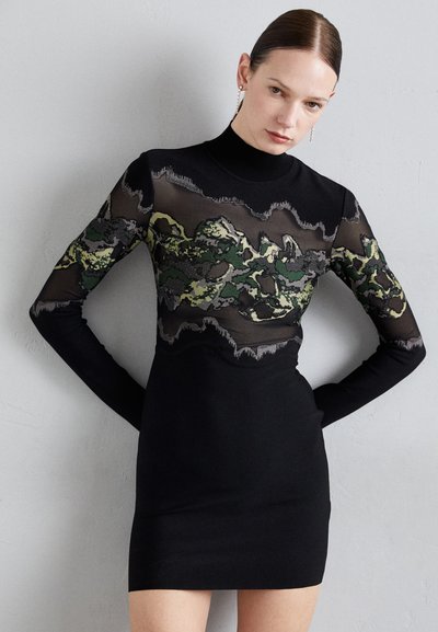 Black dress with long mesh sleeves featuring a green and gray camouflage pattern, slim fit, turtleneck design, and a smooth texture.