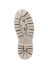 Semelle en caoutchouc beige clair avec un motif de semelle profonde, comprenant des lignes horizontales et verticales, ainsi que des éléments en forme de hashtag pour l'adhérence.