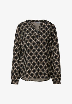 Beżowa bluzka z długim rękawem w czarne abstrakcyjne plamy, z dekoltem w serek i zapinanymi mankietami, prezentowana na białym tle.