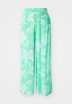 Heledad rohelised laiad püksid valge lillemustriga. Valmistatud tekstuursest kangast, elastse vöökoha ja vabalt langeva lõikega.