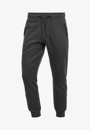 Gray jogger pants made from soft fabric, featuring adjustable drawstring, zippered side pockets, and tapered cuffs with a textured pattern.