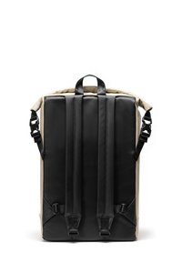 Backpack featuring a black and beige design, waterproof material, padded straps, and a sturdy top handle for versatile carrying options.