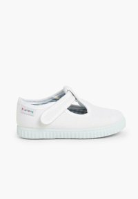 Scarpe Mary Jane bianche in tela con una fascia in Velcro, suola in gomma e rivestimento a quadri blu. Presentano un piccolo logo del marchio multicolore.