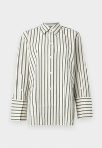 Collared, button-up shirt in cream with vertical black stripes. Features long sleeves with contrasting striped cuffs and a textured fabric.