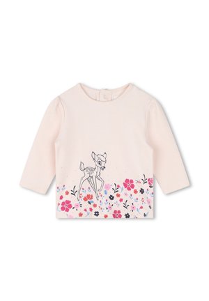 Chemise rose à manches longues avec une illustration de cerf et un imprimé floral au bas. Fabriquée en tissu doux, elle possède un col rond et une fermeture à pression au dos.