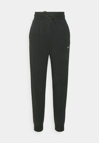Svarta Nike sweatpants med dragsko i midjan, avsmalnande ben och ribbade muddarna. Har en liten vit logotyp på vänster sida.