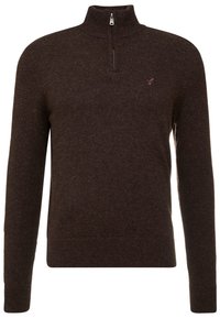 Mörkbrun långärmad stickad tröja med halv dragkedja och en liten broderad logotyp på vänster bröst.