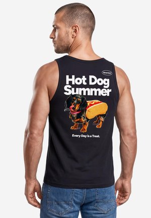 Man wearing a black tank top with text "Hot Dog Summer" and a dachshund dressed as a hot dog with "Every Day is a Treat" below.