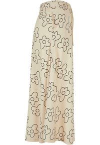 Pantaloni largi de culoare bej deschis cu un model floral negru, având un brâu elastic și o croială lejeră, confecționați dintr-un material moale și neted.