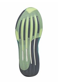 Shoe sole with green and black rubber, featuring wave-like grooves and vertical slits for flexibility and grip. Notable white accents.