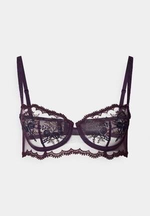 Sutien violet din dantelă, cu cupe transparente decorate cu broderie florală și margini zimțate. Bretele ajustabile din material asortat.