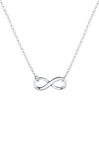Silberner Infinity-Anhänger mit zarter Kette, der sanfte Kurven und eine polierte Oberfläche aufweist. Einfaches Design ohne zusätzliche Verzierungen.