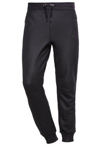 Svarta sportiga byxor med taperad passform, elastisk midja och snörning, med diskreta sidofickor och ribbade mudd.