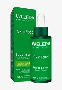Bottiglia verde e scatola di Weleda Skin Food Super Serum con tappo contagocce bianco, etichettato come cosmetico 100% naturale certificato.