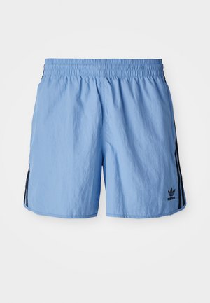 Light blue athletic shorts with an elastic waistband, featuring black side stripes and an embroidered black logo at the lower right.