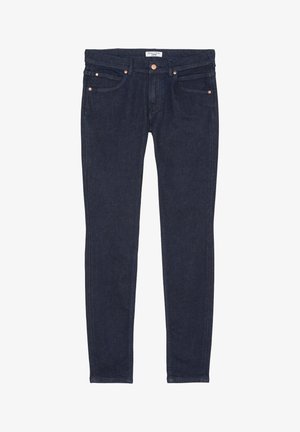 Mørkeblå denimjeans med slim fit. Har fem lommer, kobberhardware og kontrastsyninger langs sømmene.