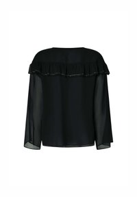 Blusa negra con un yugo con volantes y mangas largas transparentes. Presenta un escote amplio y delicados acentos de cuentas a lo largo del borde del volante.