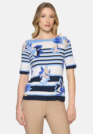 Haut à manches courtes avec un motif floral en bleu et beige, orné de rayures horizontales bleu marine. Confectionné dans un tissu doux avec un col rond.