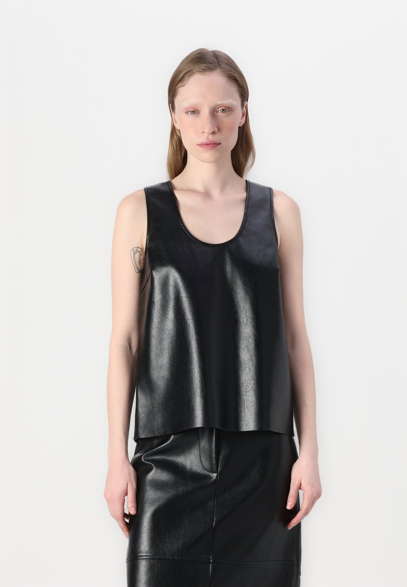 Black, sleeveless leather top with a round neckline, smooth texture, and an A-line silhouette, paired with a matching leather skirt.
