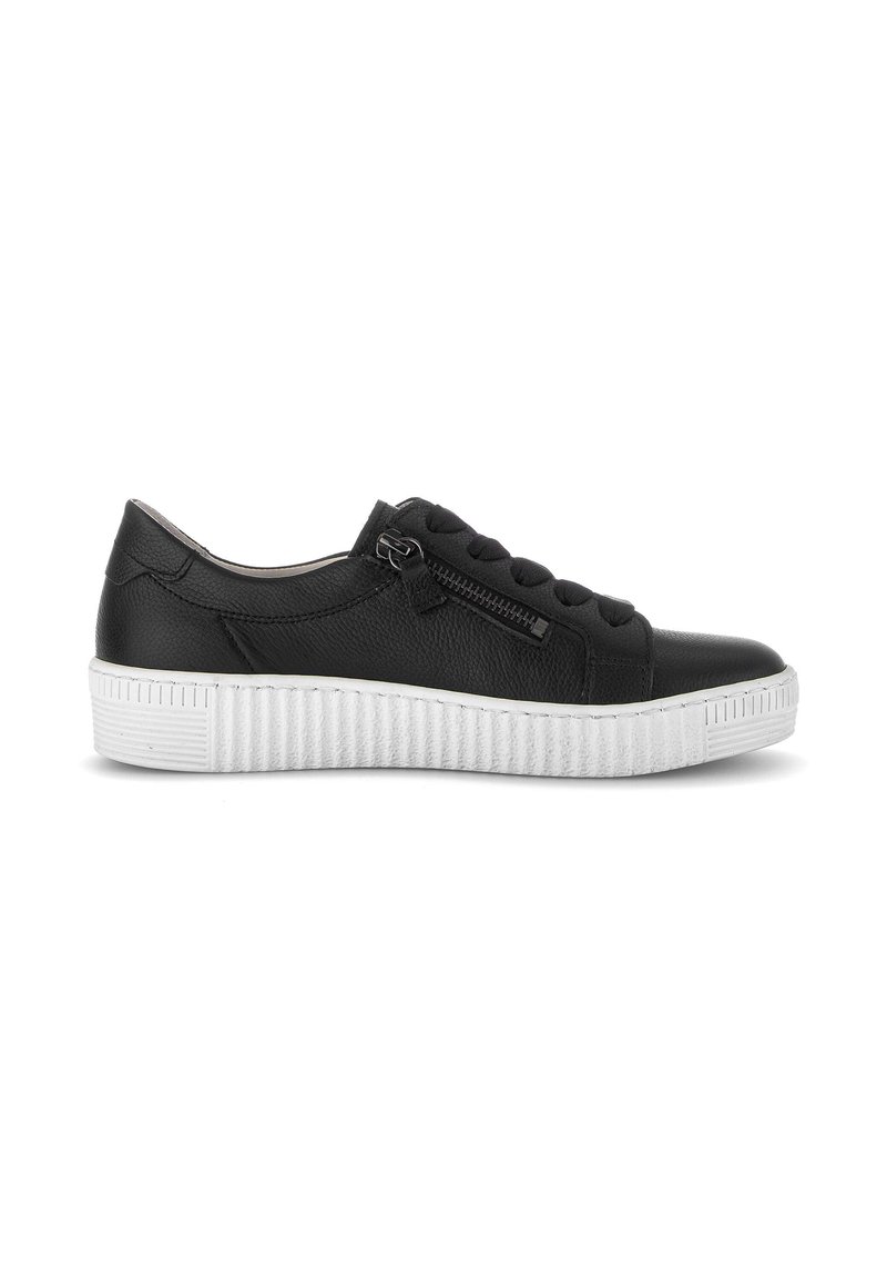 Black leather sneaker with white ridged sole, black laces, and a side zipper on a white background, shown from the outer side.