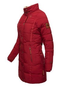 Red padded coat featuring a high collar, zippered side pockets, and a textured fabric. Includes a fur-lined collar and branding on the sleeve.