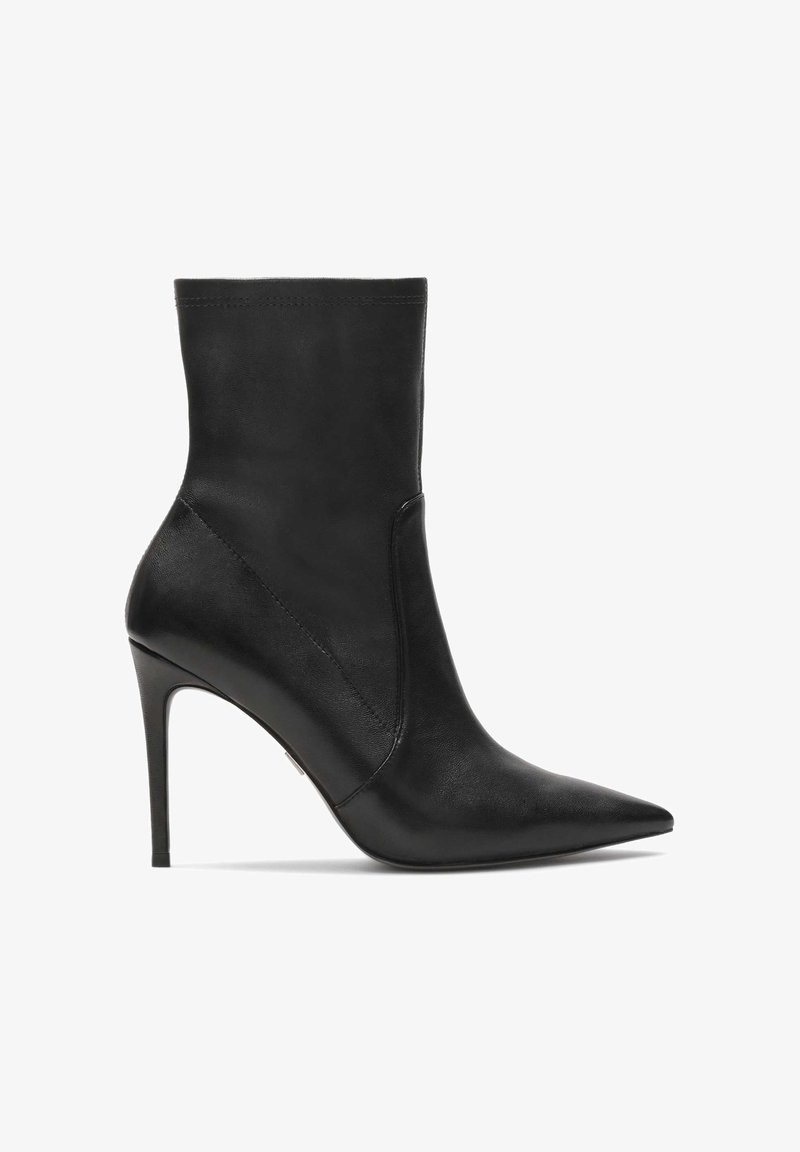 Black leather ankle boot with a pointed toe, slim high heel, and minimalistic design. Smooth texture with subtle stitching detail.