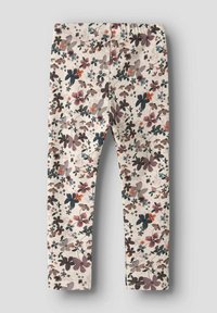 Leggings color crema con motivo floreale multicolore in sfumature di viola, marrone, blu navy e arancione, esposti piatti su uno sfondo grigio.