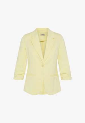 Világos sárga női blézer fodros háromnegyedes ujjakkal, egygombos záródással, ígynezetes gallérral és első zsebekkel.