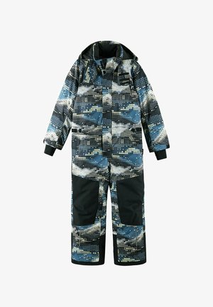 Tuta da sci in blu, nero e bianco, con motivo a pois, materiale imbottito, cappuccio e pannelli neri rinforzati sulle gambe inferiori.