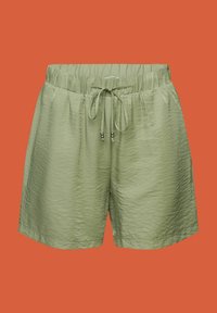 Shorts à taille élastique vert clair avec un cordon de serrage et des perles métalliques en accent sur les lacets, sur un fond uni.