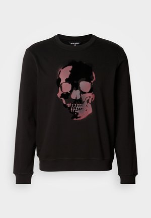 Black sweatshirt featuring a central graphic of a skull in shades of pink and black, with a crew neckline and ribbed cuffs.