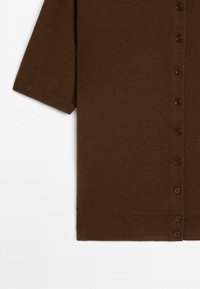 Brown knitted cardigan with short sleeves and a row of small matching buttons down the front.