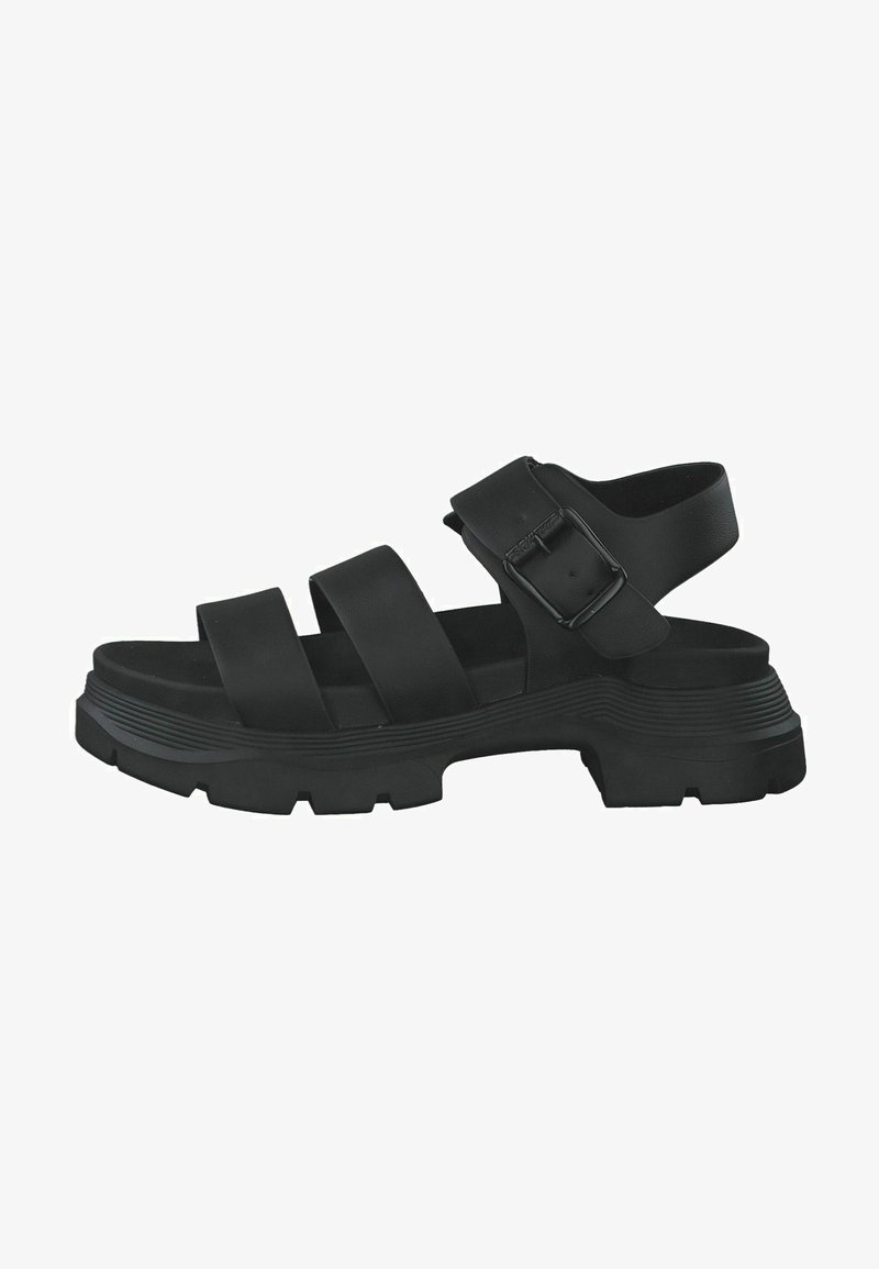 Zwarte sandaal met dikke banden, verstelbare gesp en een gestructureerde zool. Beschikt over een chunky platform met gegroefde accenten voor grip.