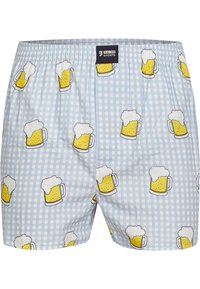 Boxer in azzurro chiaro realizzati in cotone, con un motivo a scacchi che presenta boccali di birra alternati in giallo, bianco e contorni neri.