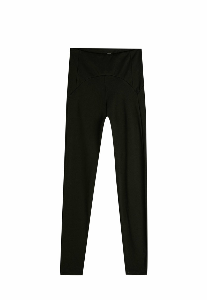 Leggings negras de material elástico, con una cinturilla alta, textura suave y una silueta ajustada sin patrones visibles.