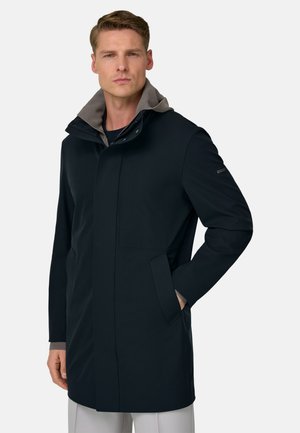 Schwarzer Mantel mit grauer Kapuze. Verfügt über einen Reißverschluss vorne, Seitentaschen und ein schlankes Design für einen modernen Look.