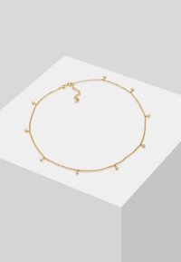 Collier en or avec de petites perles pendantes espacées uniformément le long de la chaîne, doté d'un fermoir et d'une chaîne d'extension réglable.