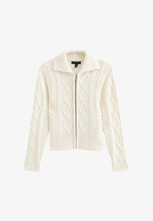 White knit cardigan with a high collar, zipper closure, and textured cable pattern. Features ribbed cuffs and hem.