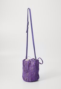 Purple woven bucket bag with a leather strap, featuring vertical strips and a textured finish. Includes a drawstring closure.