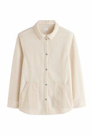 Veste beige clair avec un tissu texturé, fermeture à boutons à l'avant et deux poches latérales, conçue pour une coupe décontractée et un style casual.