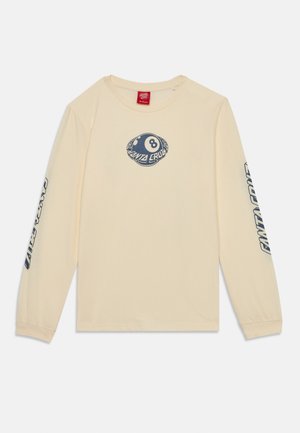 Long-sleeve cream cotton t-shirt featuring a blue graphic of an eight ball on the chest and “Santa Cruz” text down the sleeves.