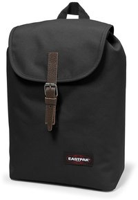 Black backpack made of durable material, featuring a fold-over flap, brown leather strap, and Eastpak logo on the front. Simple rectangular design.