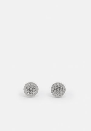 Round silver earrings with a cluster of six clear stones in the center, featuring the engraved text "TOMMY HILFIGER" around the edge.