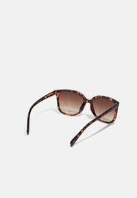 Tortoiseshell sunglasses with a square frame, gradient brown lenses, and slender black arms featuring subtle patterns. No visible hardware details.