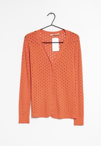 Orange stickad kofta med V-hals, knappfront och öppen design med jämnt fördelade hål. Långa ärmar och ribbade muddar.