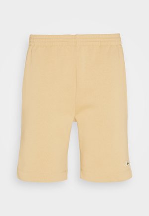 Pantalones cortos de algodón amarillo claro con cintura elástica, con un dobladillo plano y un pequeño logotipo en el muslo.