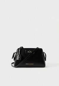 Black leather handbag with a structured design, featuring gold accents and logos. Includes a detachable tag and a long shoulder strap.